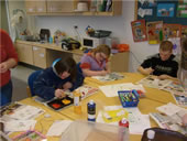 Pupils sat at table painting