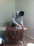 Student ironing clothes