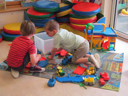Children playing together inside the Nursery